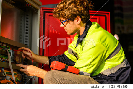 Mechanical engineer technician checking and inspecting machine at repair shop 103995600