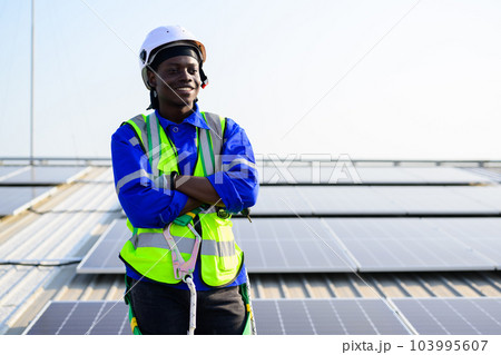 Smiling portrait of happy engineer technician working on rooftop Smiling portrait of happy engineer technician working on rooftop 103995607