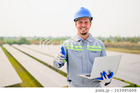Maintenance technician working on ecological solar cell farm Maintenance technician working on ecological solar cell farm 103995609