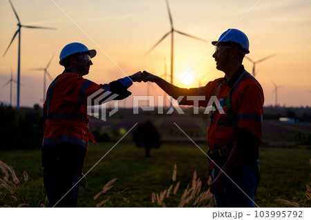 Renewable energy engineer working on wind turbine Renewable energy engineer working on wind turbine 103995792