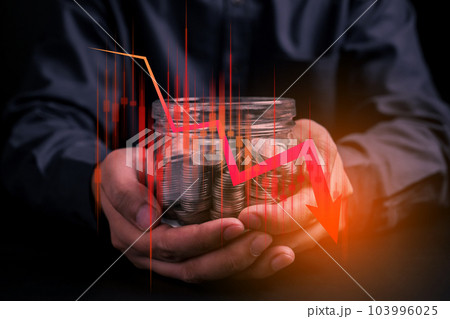Stressed businessman and financial failure graphs showing loss 103996025
