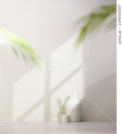 Vases and objects on the table in a warm room with sunlight coming in Vases and objects on the table in a warm room with sunlight coming in 104000997