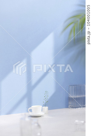 Vases and objects on the table in a warm room with sunlight coming in 104001005