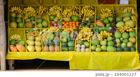 Various tropical fruits are on display on the stall stand. Various tropical fruits are on display on the stall stand. 104001227