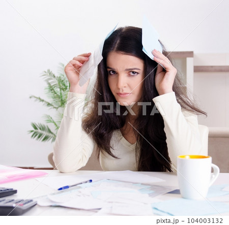 Young woman with receipts in budget planning concept Young woman with receipts in budget planning concept 104003132