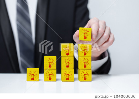 Businessman collecting ideas. Ideasmaker. Idea, brainstorming and creativity concept 104003636