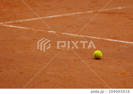 tennis court covered with red clay for championship or sports competition. tournament for athletes. tennis court covered with red clay for championship or sports competition. tournament for athletes. 104003818