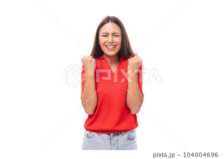 a young European woman with dark straight hair wearing a red short-sleeved shirt actively gestures 104004696