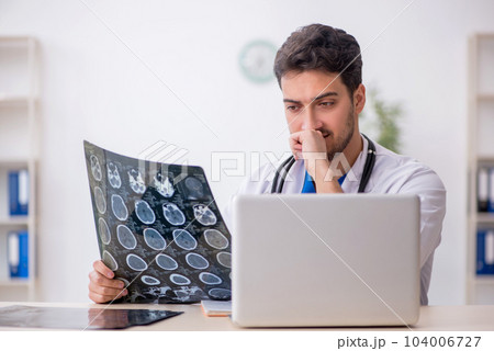 Young male doctor radiologist working in the clinic 104006727