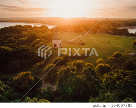 Park in Nusa Dua with monument and sunset light in Bali, Aerial view 104007280