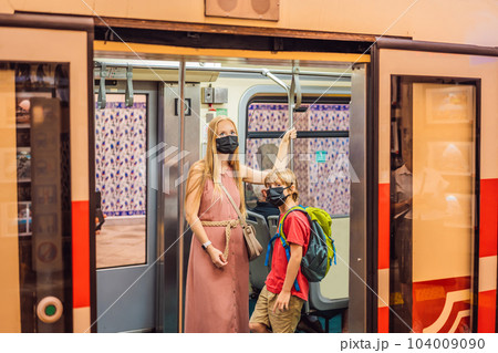 Mom and son tourists on Historical tunnel funicular train in Istanbul 104009090