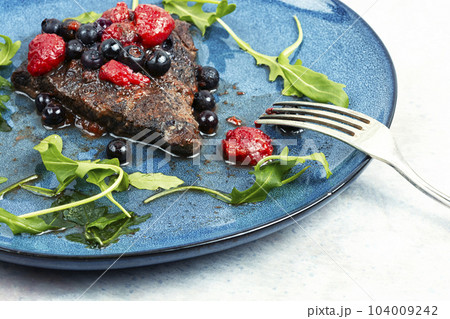 Meat with berry sauce. 104009242