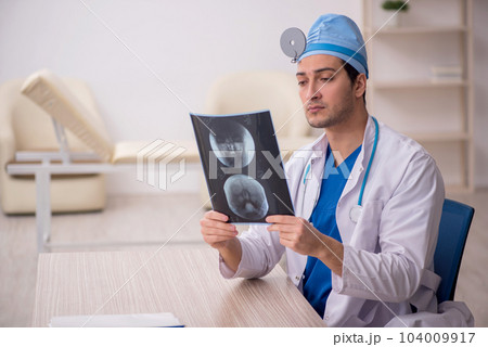 Young male doctor radiologist working in the clinic Young male doctor radiologist working in the clinic 104009917