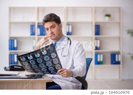 Young male doctor radiologist working in the clinic 104010970