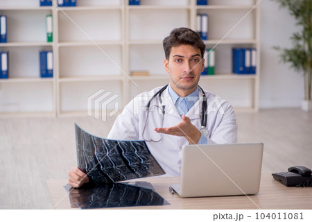 Young male doctor radiologist working in the clinic 104011081