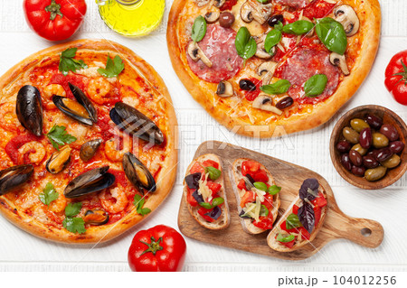 Italian cuisine. Pizza and toasts Italian cuisine. Pizza and toasts 104012256