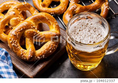 Freshly baked homemade pretzels and beer 104012337