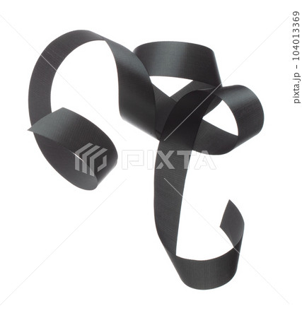 Black ribbon long straight fly in air with curve roll shiny. Black ribbon for present gift birthday party to wrap around decorate and make of textile cloth long straight. White background isolated 104013369