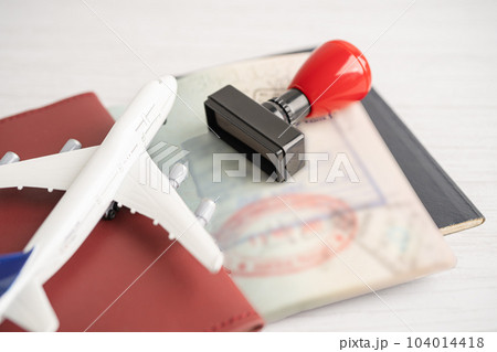 Approved Stamp visa and passport document to immigration at airport in country. 104014418