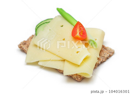 Whole Grain Crispbread with Cheese, Fresh Cucumber, Radish, Tomato and Green Onions - Isolated Whole Grain Crispbread with Cheese, Fresh Cucumber, Radish, Tomato and Green Onions - Isolated 104016301