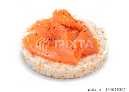 Rice Cake Sandwich with Fresh Salmon Slices Isolated on White Rice Cake Sandwich with Fresh Salmon Slices Isolated on White 104016305