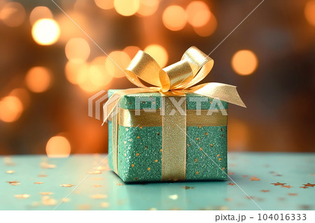 Mint gift box with golden bow on the background...のイラスト素材 [104016333 ...