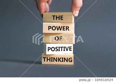Positive thinking symbol. Concept words The power of positive thinking on wooden block. Beautiful grey background. Businessman hand. Business, motivational positive thinking concept. Copy space. 104018424
