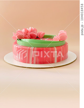 festive pink mousse cake with decor on beige background. copy space. festive pink mousse cake with decor on beige background. copy space. 104018458