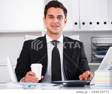 Successful businessman using laptop Successful businessman using laptop 104019771