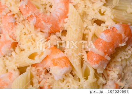 Delicious fresh penna pasta with shrimp, sauce, cheese, salt and spices 104020698