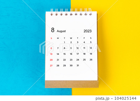 The August 2023 Monthly desk calendar for 2023 year on blue and yellow background. 104025144