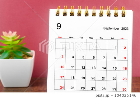Close up the September 2023 Monthly desk calendar on wooden table. Close up the September 2023 Monthly desk calendar on wooden table. 104025146