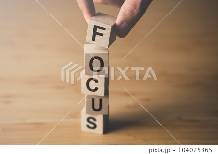 Wooden block of focus. businees achievement goal and concentration concept. 104025865