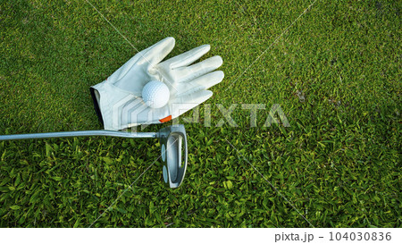 Golf equipment on green grass, close up view. Golf equipment on green grass, close up view. 104030836