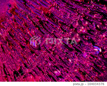 Macro images of streaming bubbles in ice with side lighting Macro images of streaming bubbles in ice with side lighting 104034376