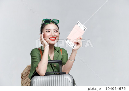 Traveler woman hold suitcase passport ticket isolated on plain white background 104034676