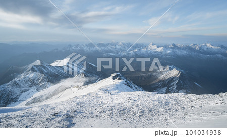 Alpine landscape with hut surrounded by big peaks covered by snow and ice, Austrian Alps, Europe Alpine landscape with hut surrounded by big peaks covered by snow and ice, Austrian Alps, Europe 104034938