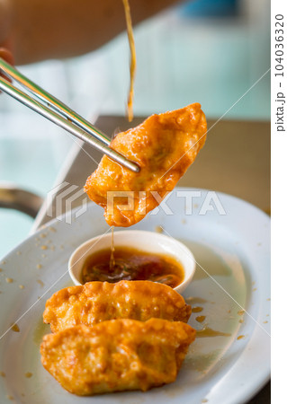 Deep fried gyoza crispy and golden colour Deep fried gyoza crispy and golden colour 104036320