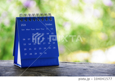October 2024 blue table calendar with customizable space for text. Calendar concept and copy space. October 2024 blue table calendar with customizable space for text. Calendar concept and copy space. 104041577
