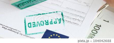 Approval of visa for travel to European Union employee of embassy puts stamp Approval of visa for travel to European Union employee of embassy puts stamp 104042688