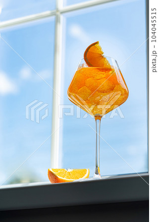 Glass of Aperol spritz cocktail 104045515