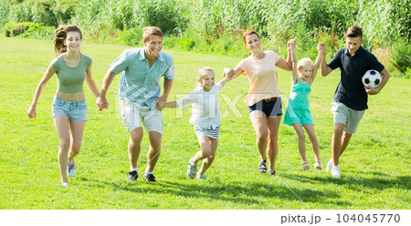 Family being active and running Family being active and running 104045770