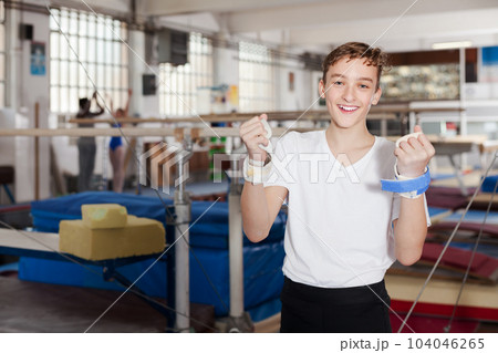 Happy teenage boy in gym 104046265