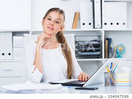 Young businesswoman at working place Young businesswoman at working place 104047598