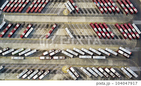 Bus depot red buses top-down view aerial drone shot 104047917