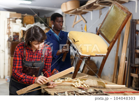Restoration wooden chair in studio 104048303