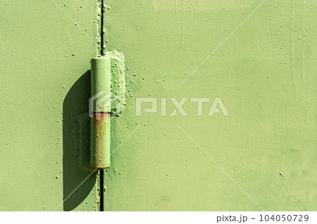 Metal hinge of the garage door. Powerful door hinge. 104050729