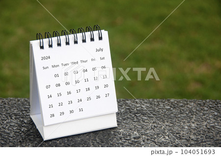 July 2024 white table calendar with customizable space for text. Calendar concept and copy space 104051693