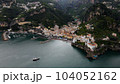 Aerial view of the famous tourist resort of the Amalfi coast, boat on the water 104052162