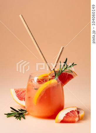Cocktail with grapefruit, rosemary, and ice. 104060149